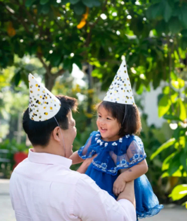 adult and child at birthday party